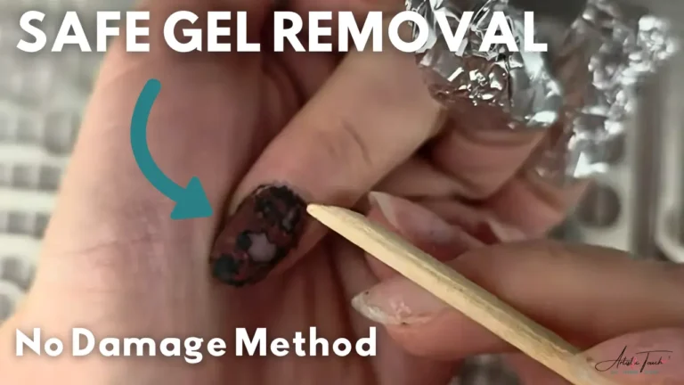 Proper technique for gently scraping softened gel polish with orange wood stick showing crumbly texture indicating correct soaking time