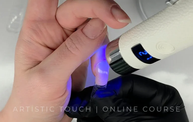 Flash curing technique for no-file BIAB dual forms application showing strategic zone curing method for Cloud Dancer square nails