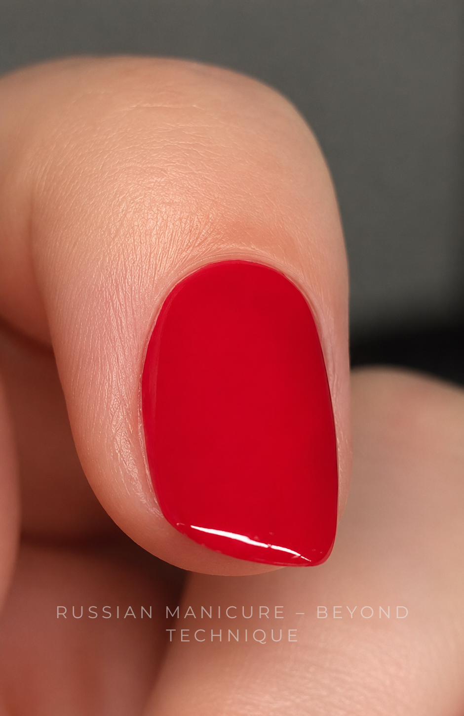 Macro Russian Manicure result showing a deep cuticle pocket with precise red gel-polish application
